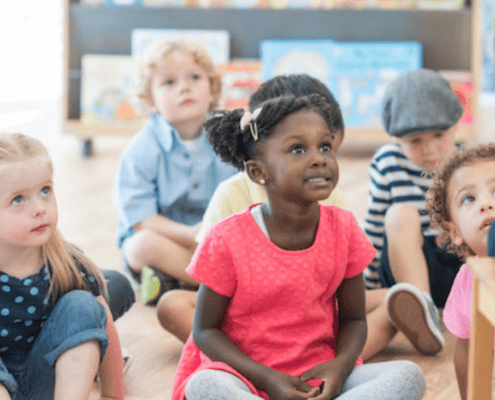 Children listening intently during storytime.