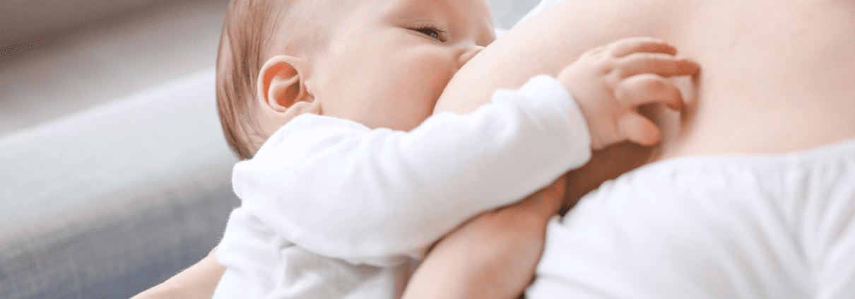 Baby breastfeeding from mother, intimate moment.