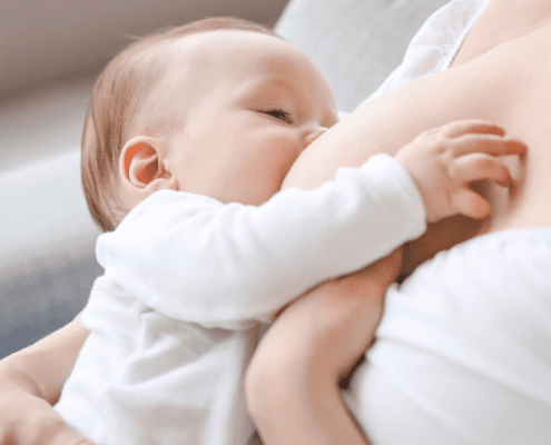 Baby breastfeeding from mother, intimate moment.