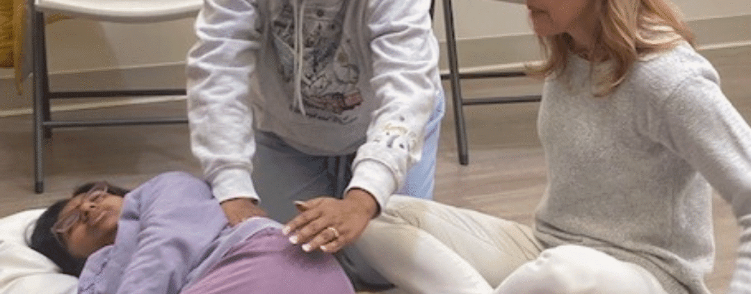 People practicing a relaxation or healing technique.