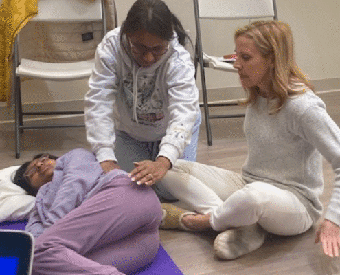 People practicing a relaxation or healing technique.