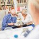 Elderly couple looking at a photo album.